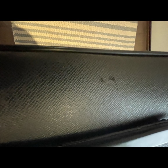 This is a Louis Vuitton travel bag black. - Picture 12 of 16